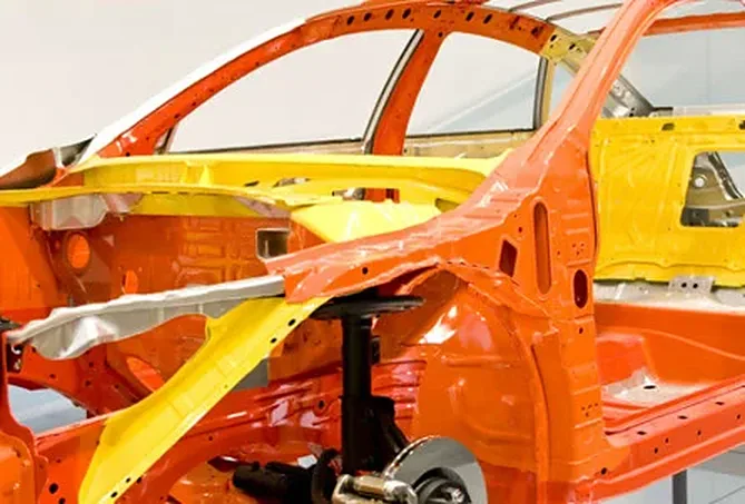 A vehicle being sprayed in the Castlepark spray booth